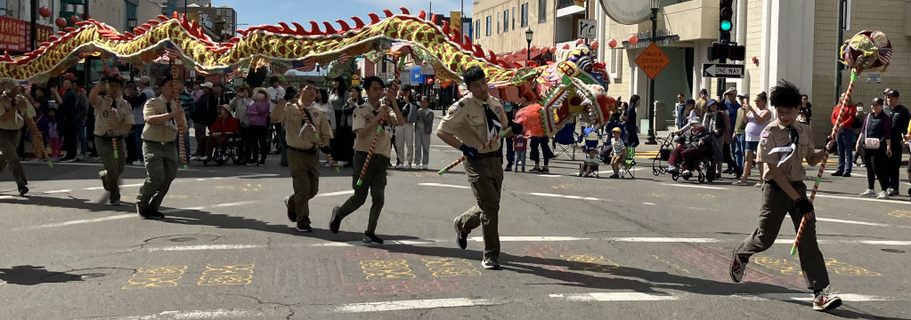 Scouts hold a dragon and chase an orb