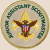 Junior assistant scoutmaster badge: the first class badge but without the scroll